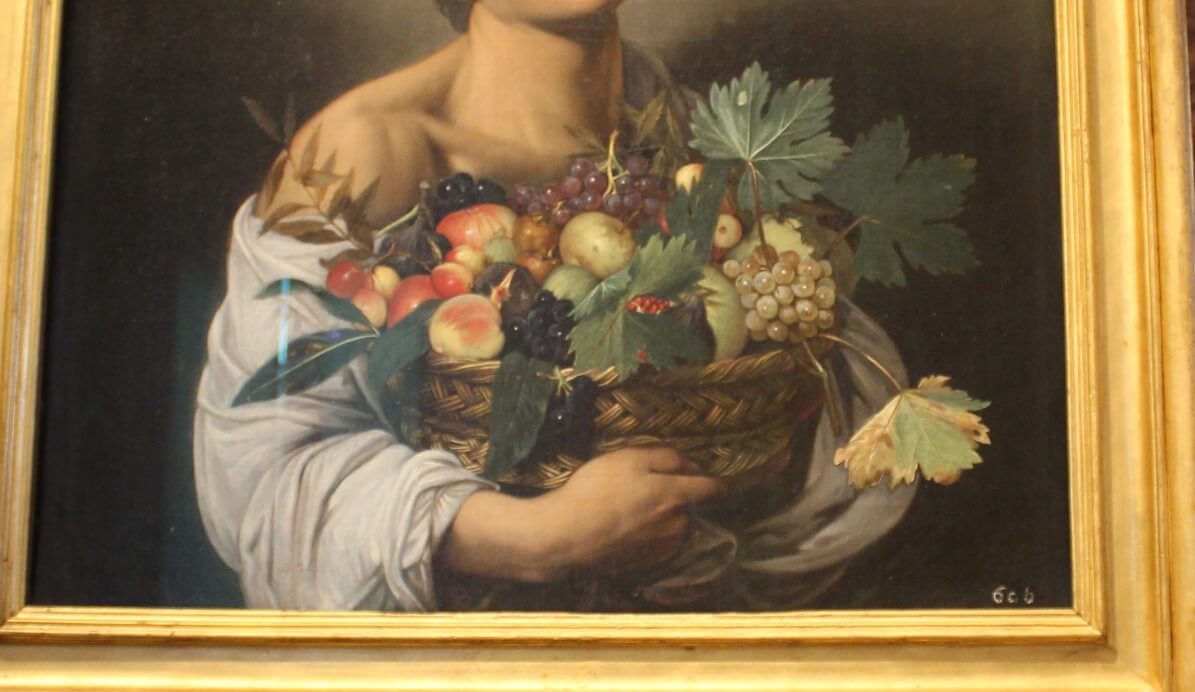 Caravaggio Boy with a fruit painting