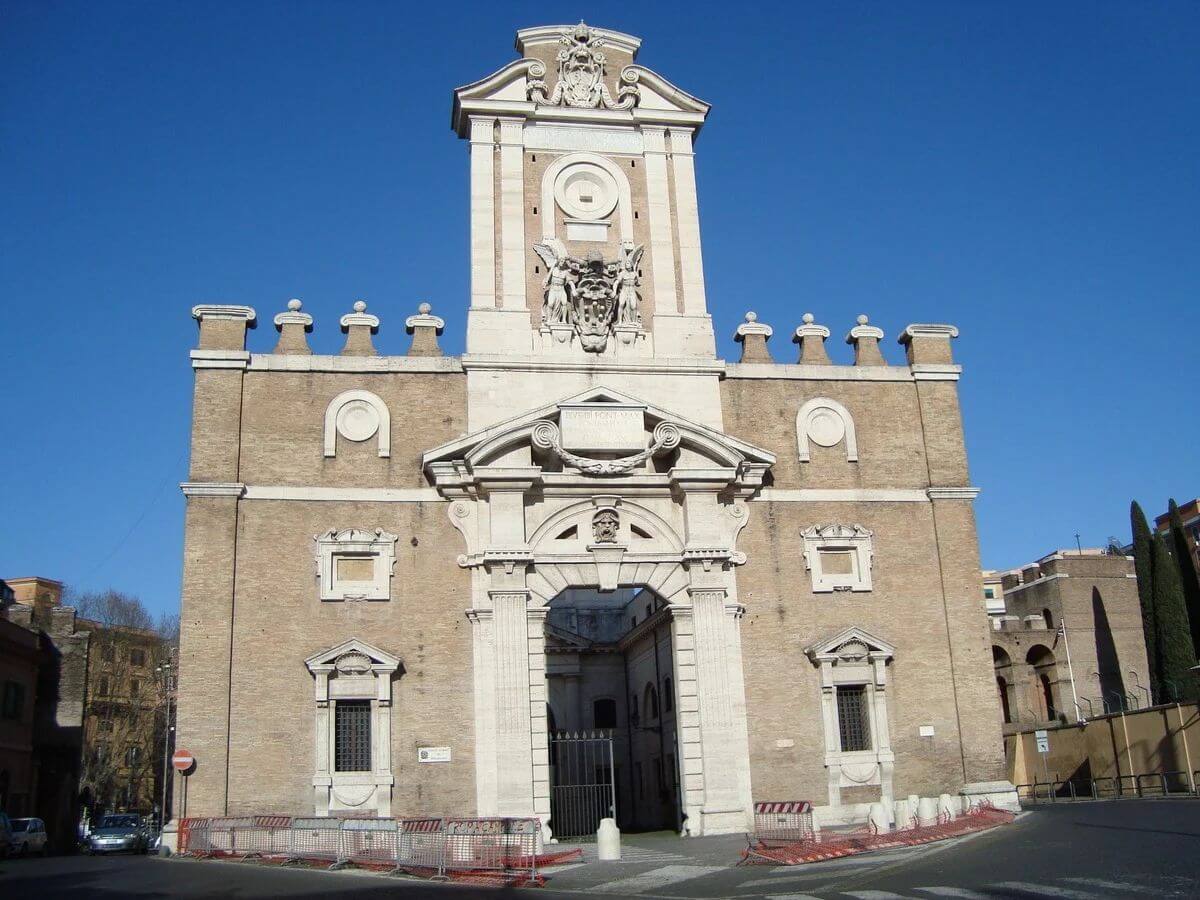 City-facing facade of Porta Pia in Rome, with its central portal and papal coats of arms