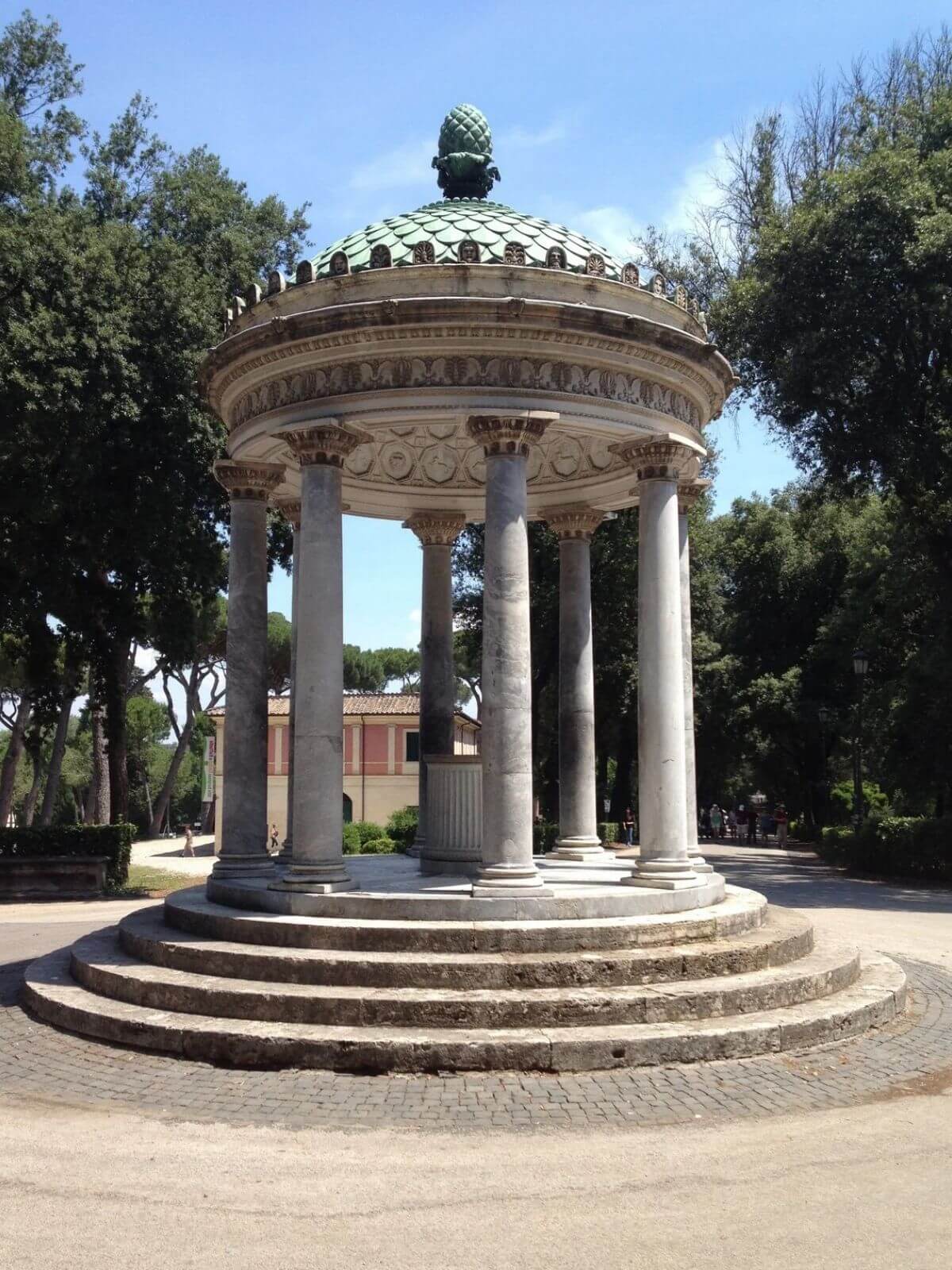 Circular Temple of Diana surrounded by trees in Rome