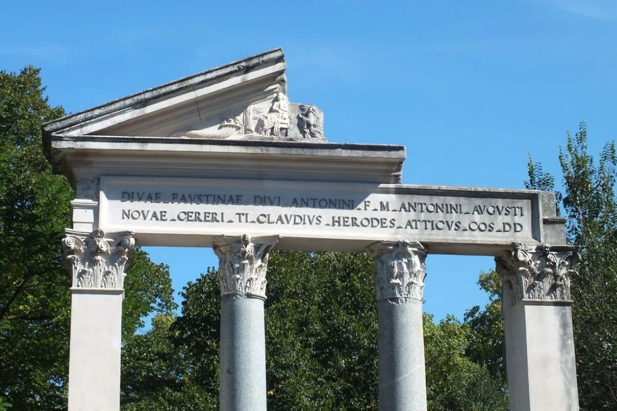 Columned portico with Latin inscription in Villa Borghese gardens in Rome