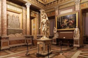 Bernini’s Aeneas carrying Anchises, with Ascanius beside them, in the Borghese Gallery.