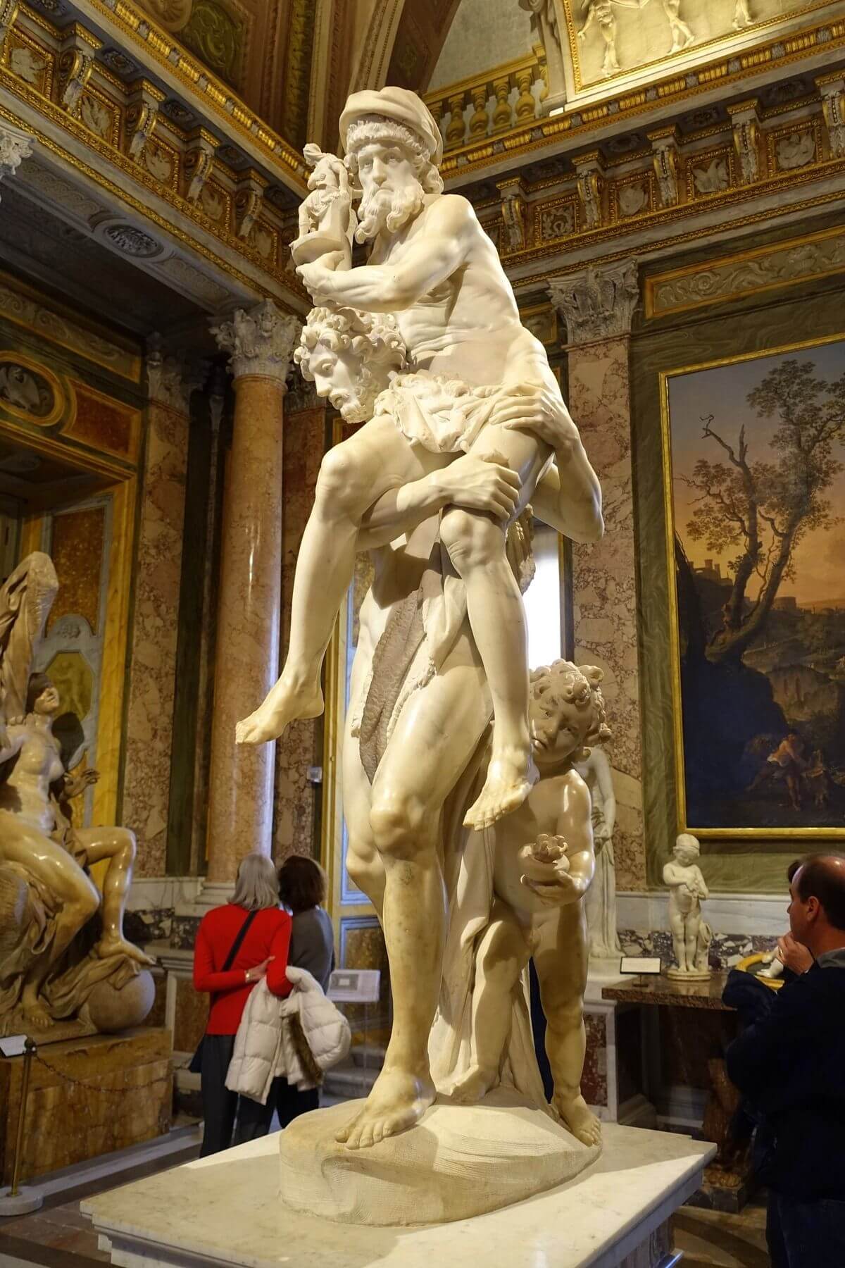 Anchises holds the Penates above Aeneas’s head as Ascanius carries a flame beside them.